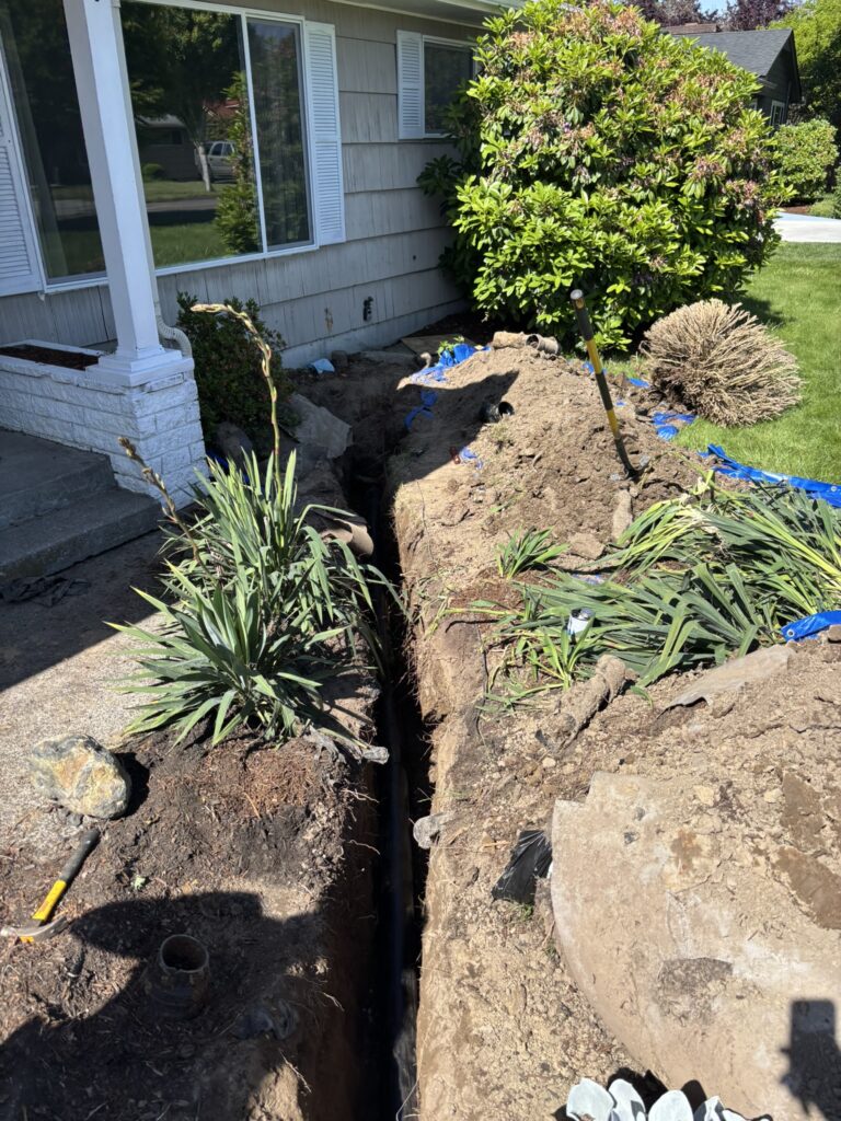 Residential main sewer line replacement and underground plumbing excavation
