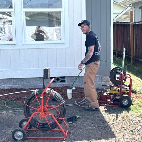 Platinum Plumbing technician performing broken sewer cleanout extraction and sewer line repair in Longview WA.