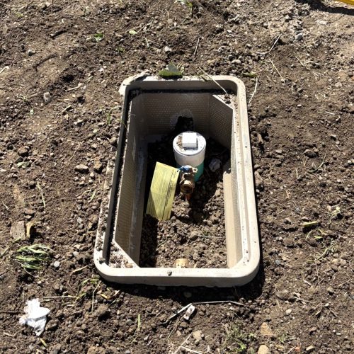 Residential water meter setter installed inside a new meter box